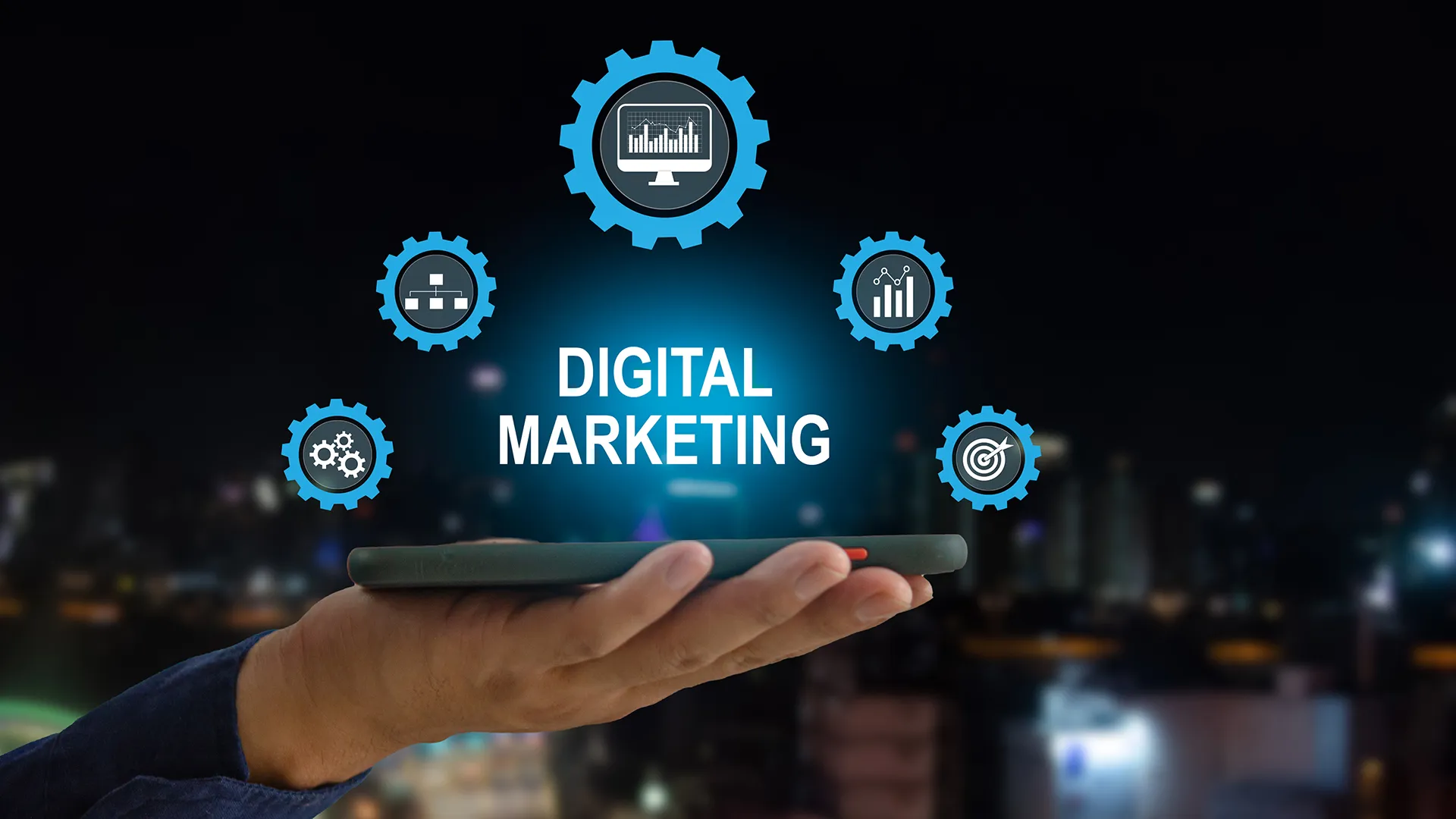 Hand holding a smartphone with digital marketing icons and gears, emphasizing technology and data-driven strategies for business growth.